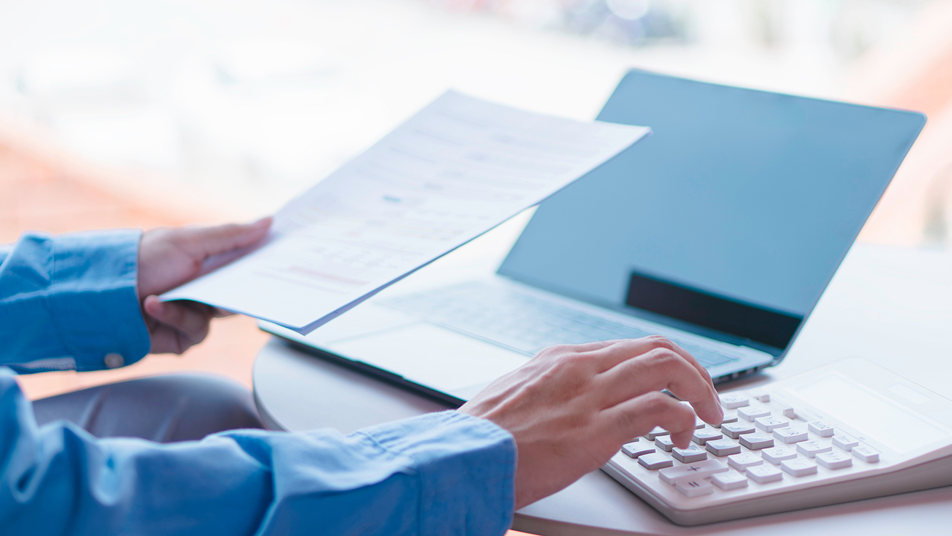 Person reviewing reports