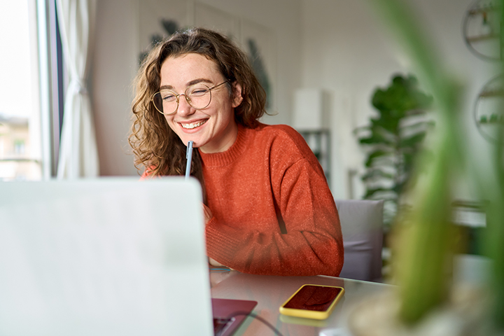 Image of person working on computer at home