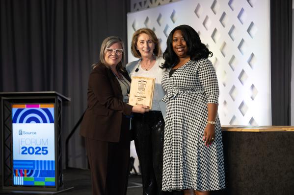 Winners accepting award for the 2025 achievement in customer experience