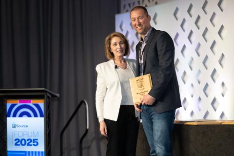 Attendee accepting the award for Achievement in Employee experience at Forum